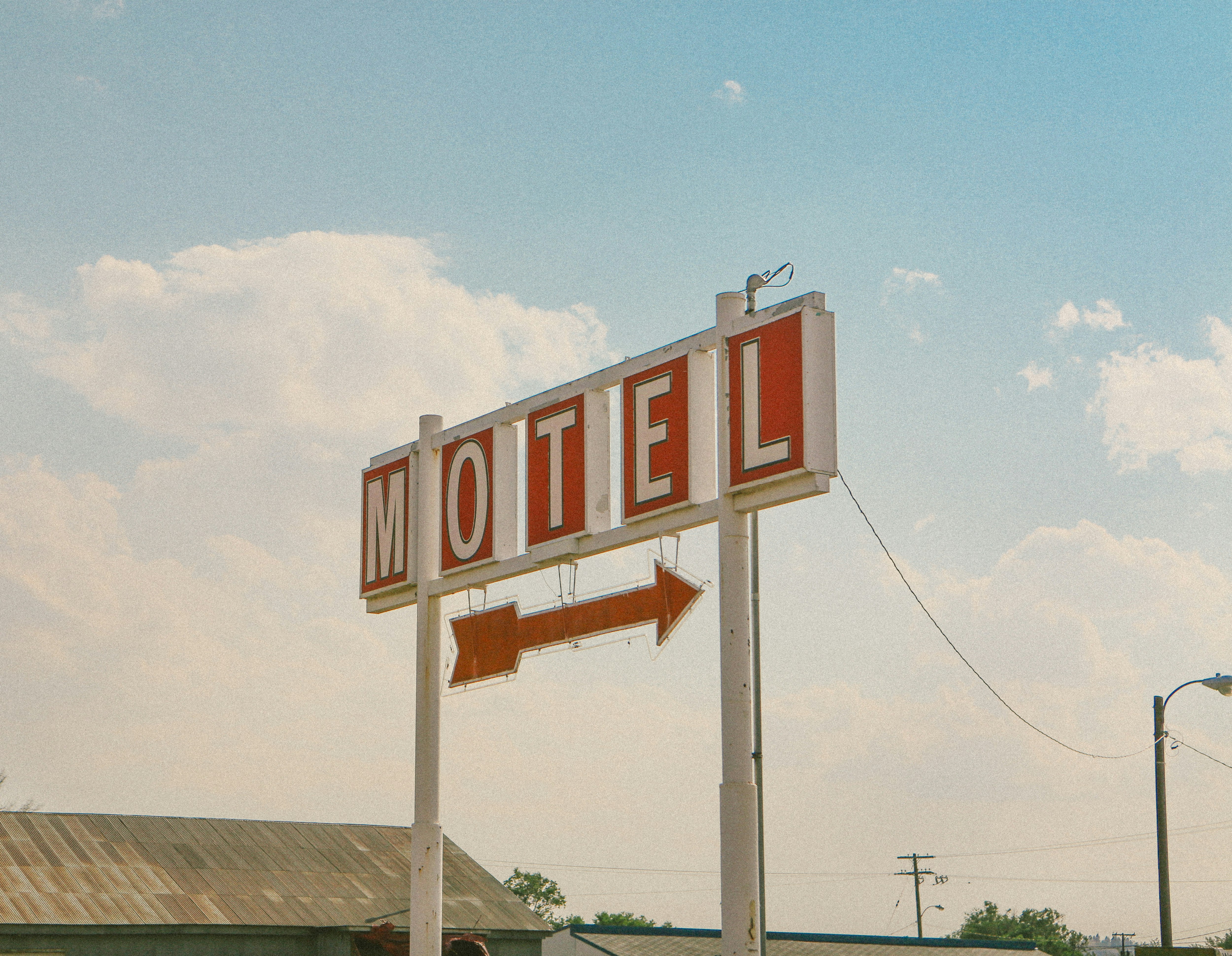 red and white motel signage